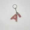 Porte clé lettre A rose avec paillettes dorées