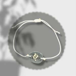 bracelet ovale transparent avec pépites argentées