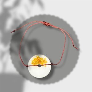 bracelet rond blanc avec pépites dorées