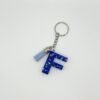Porte clé lettre F bleu avec paillettes