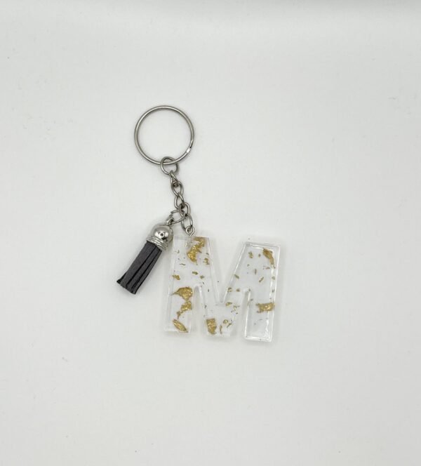 Porte clé lettre M transparent