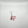 Porte clé lettre P rose avec paillettes dorées