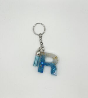 Porte clé lettre R bleu et blanc avec paillettes dorées